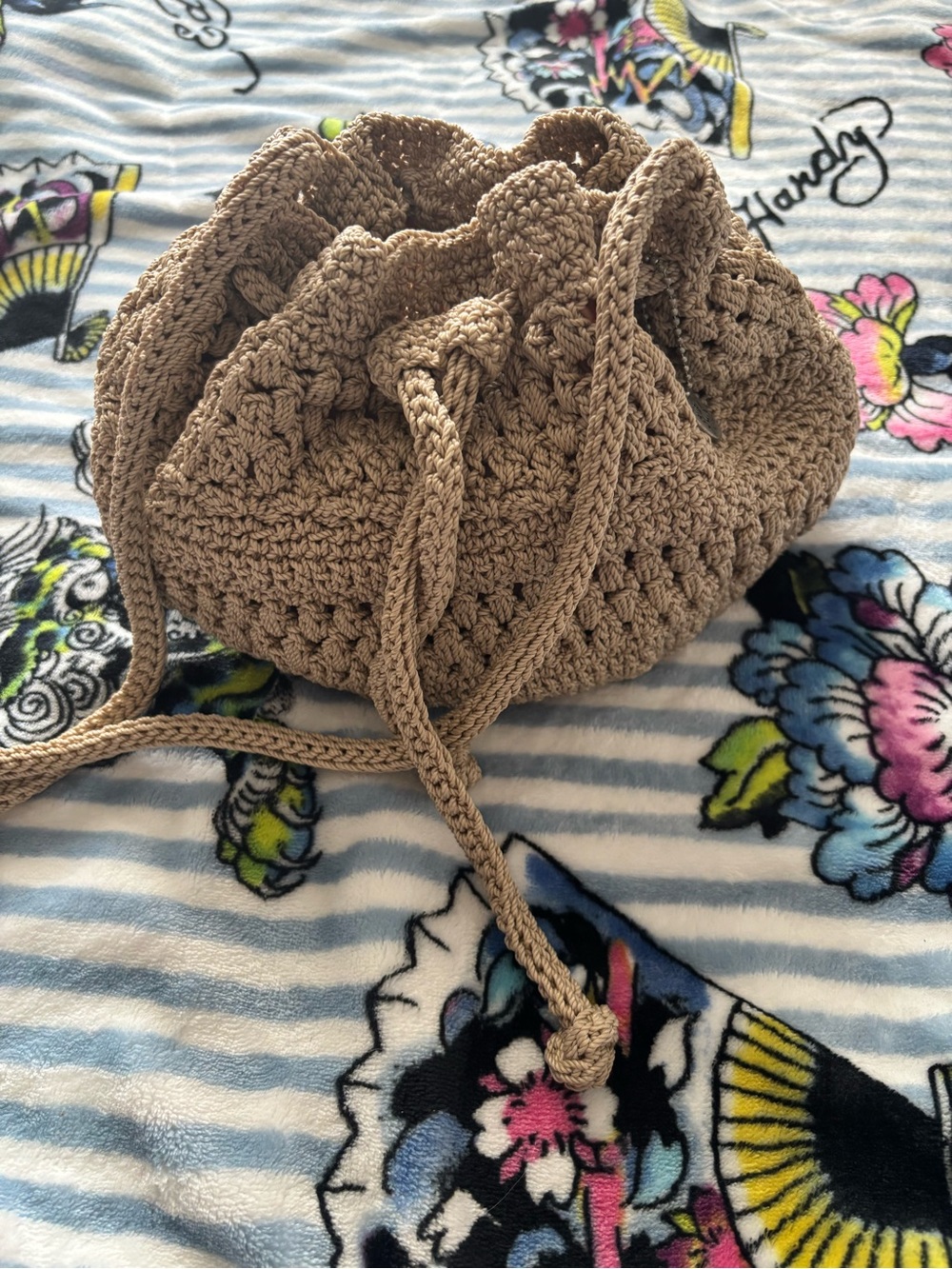 The Sak Crocheted Drawstring Crossbody Bag in Tan